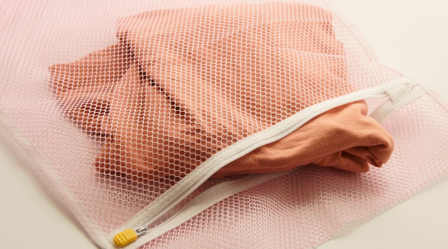 How to Use a Pool Noodle, a Pillowcase and a Mesh Bag to Avoid Creases, Snags and Lost Socks